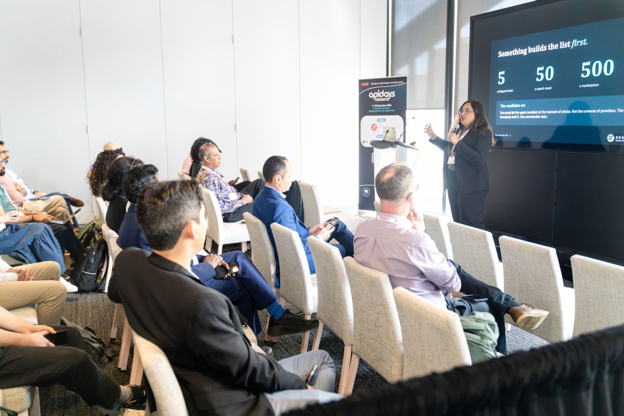 Keerthana Mahadevan on stage at apidays Toronto, talk on AI agents choosing providers